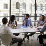 Corporate business team and manager in a meeting, close up