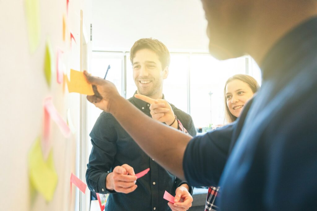 Happy employee people on a brainstorming at startup office