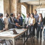 Portrait of mixed age corporate working team with multiracial and disabled
